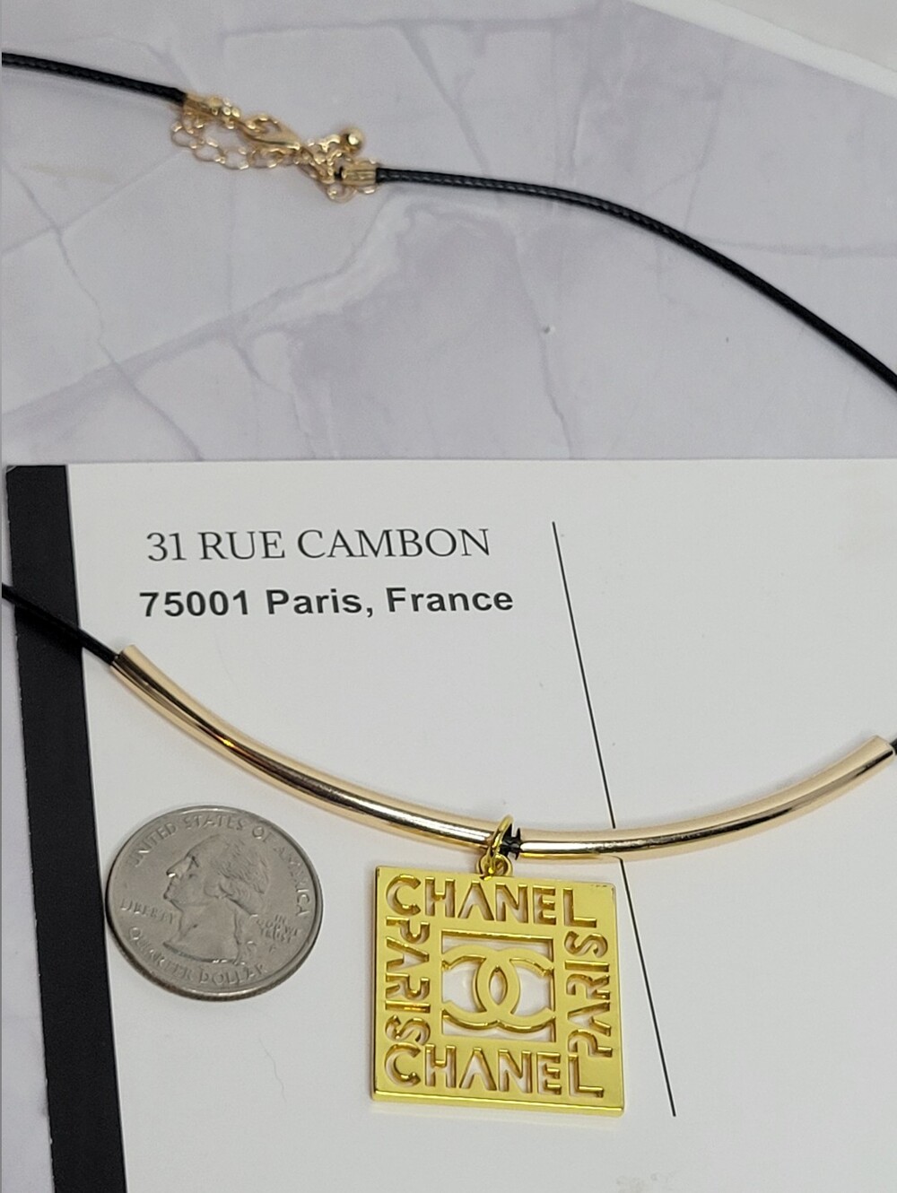 CHANEL Gold-Tone Square Logo Zip Pull Pendant Necklace with Black Cord